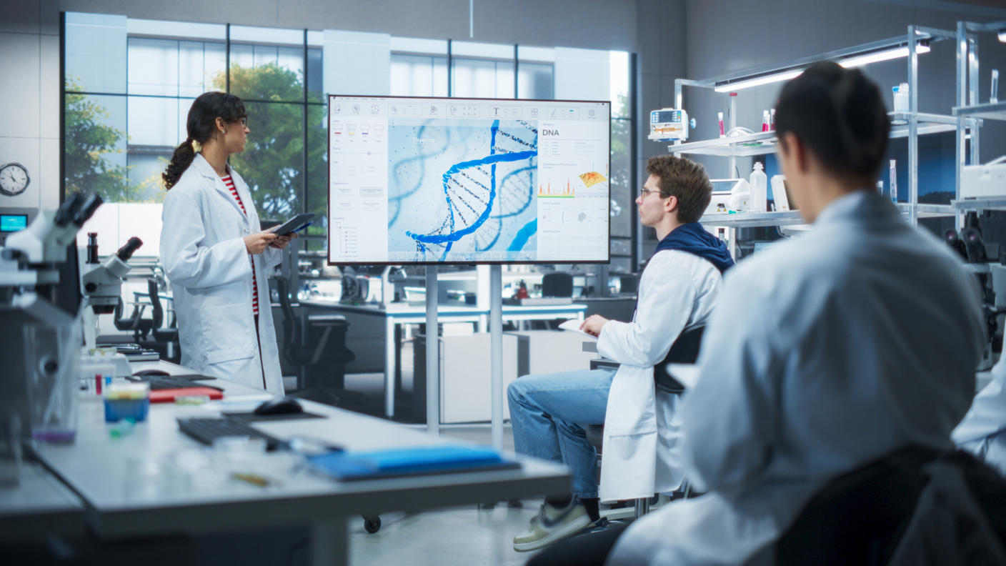 Graduate students reviewing research data