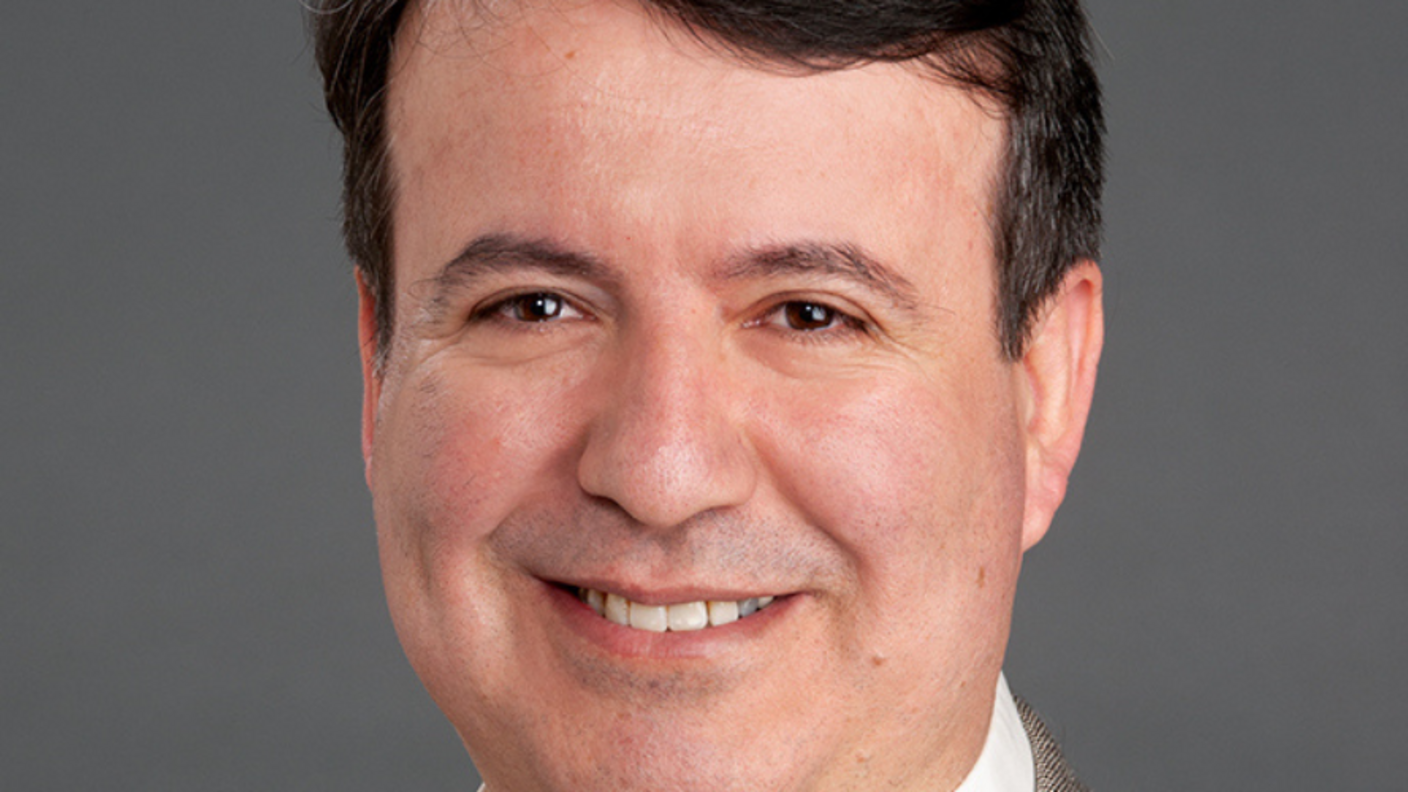 Headshot of Umit Topaloglu.