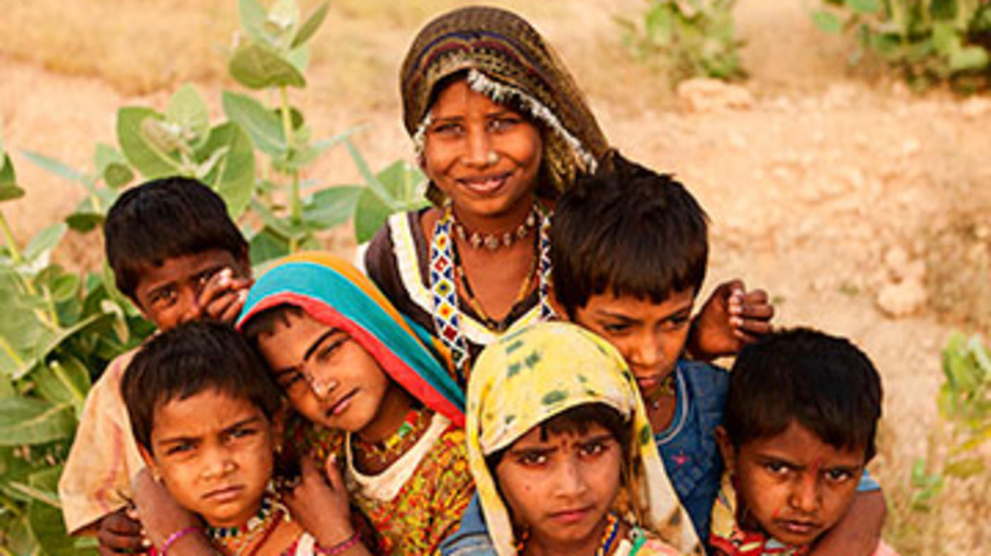 A group of Indian children wearing brightly colored clothing.