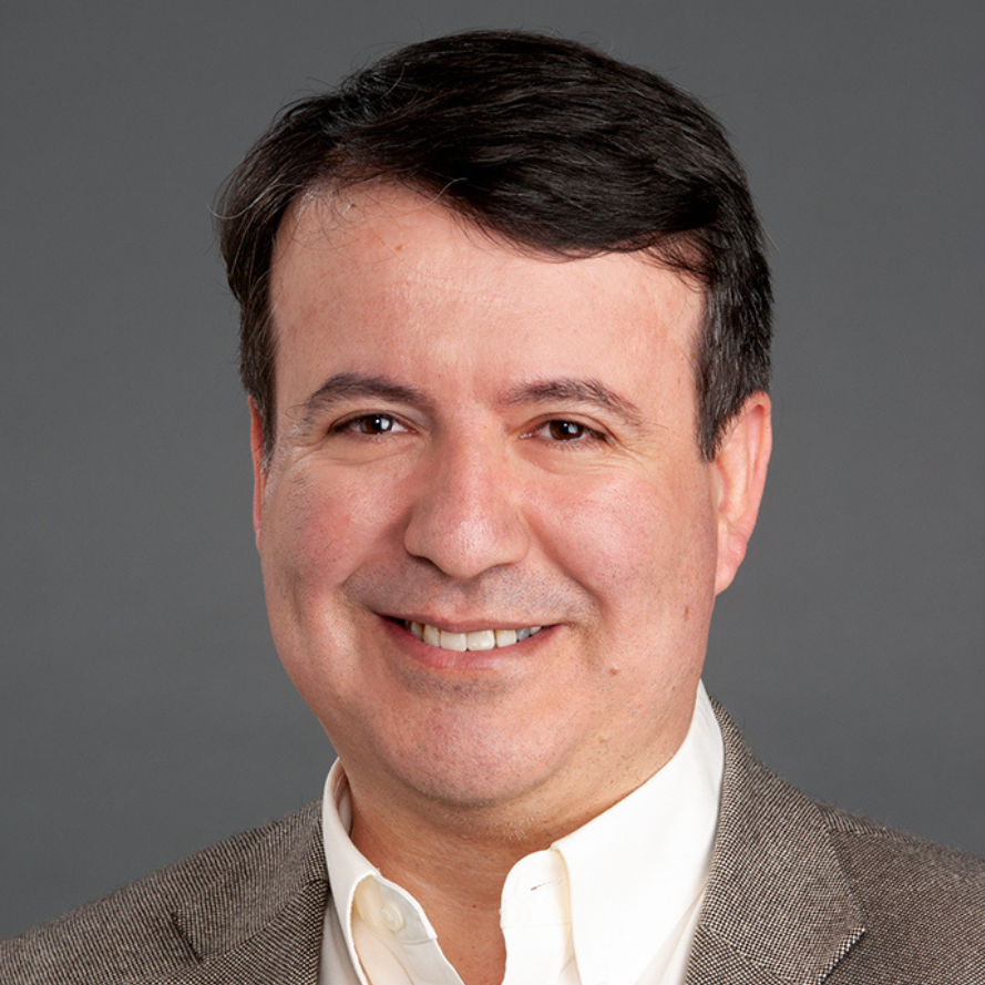 Headshot of Umit Topaloglu.