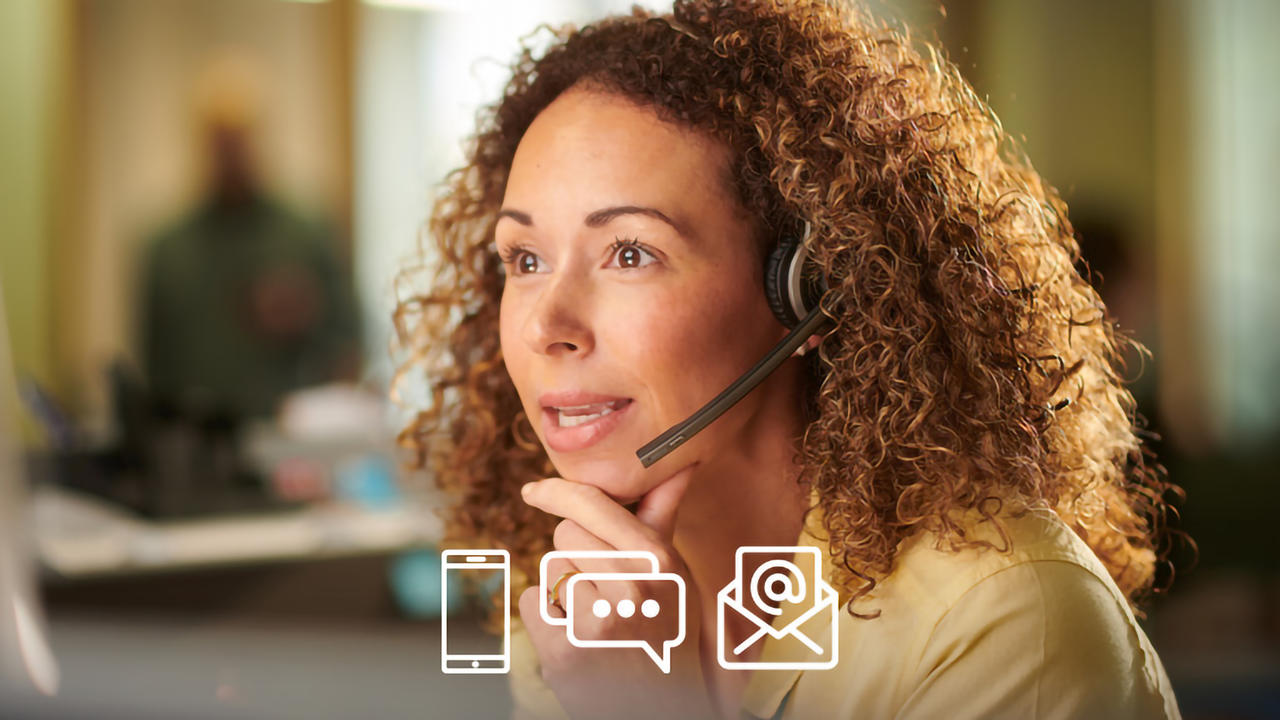 Representative on a headset helping a patient who has called in for assistance