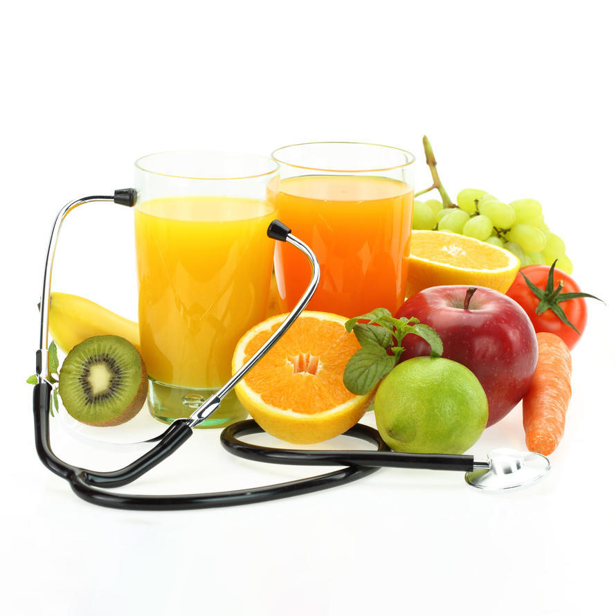 Glasses of juice, selection of fruit, and stethoscope.